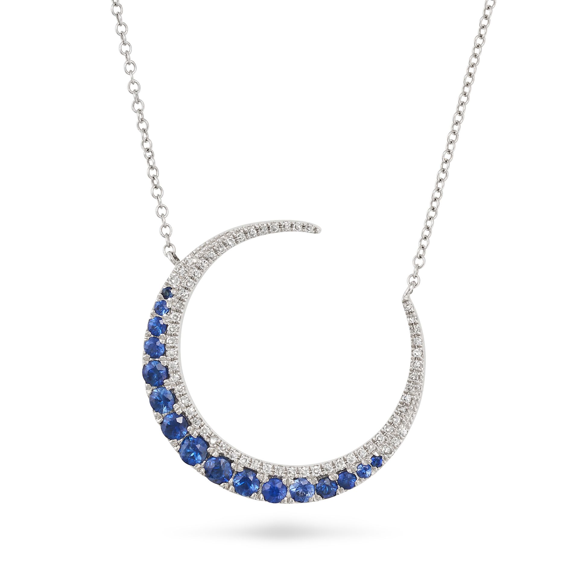 A SAPPHIRE AND DIAMOND CRESCENT MOON NECKLACE in white gold, the pendant designed as a crescent m...