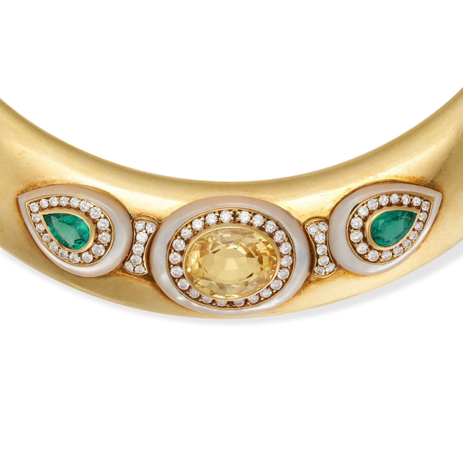 FRED, A YELLOW SAPPHIRE, EMERALD, DIAMOND AND MOTHER OF PEARL TORQUE NECKLACE in yellow gold, the... - Image 2 of 2