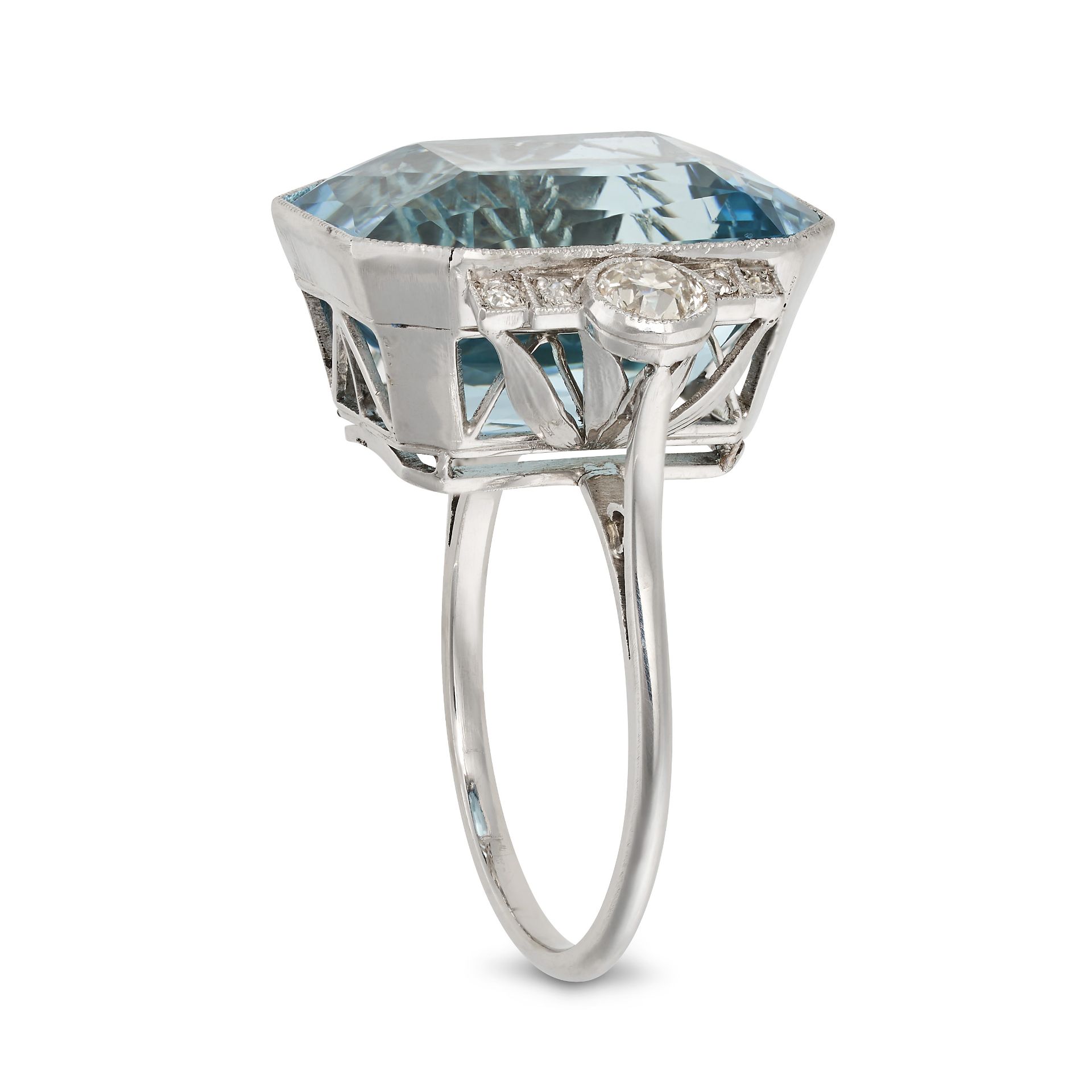 AN AQUAMARINE AND DIAMOND DRESS RING in platinum, set with an octagonal step cut aquamarine of ap... - Image 2 of 2