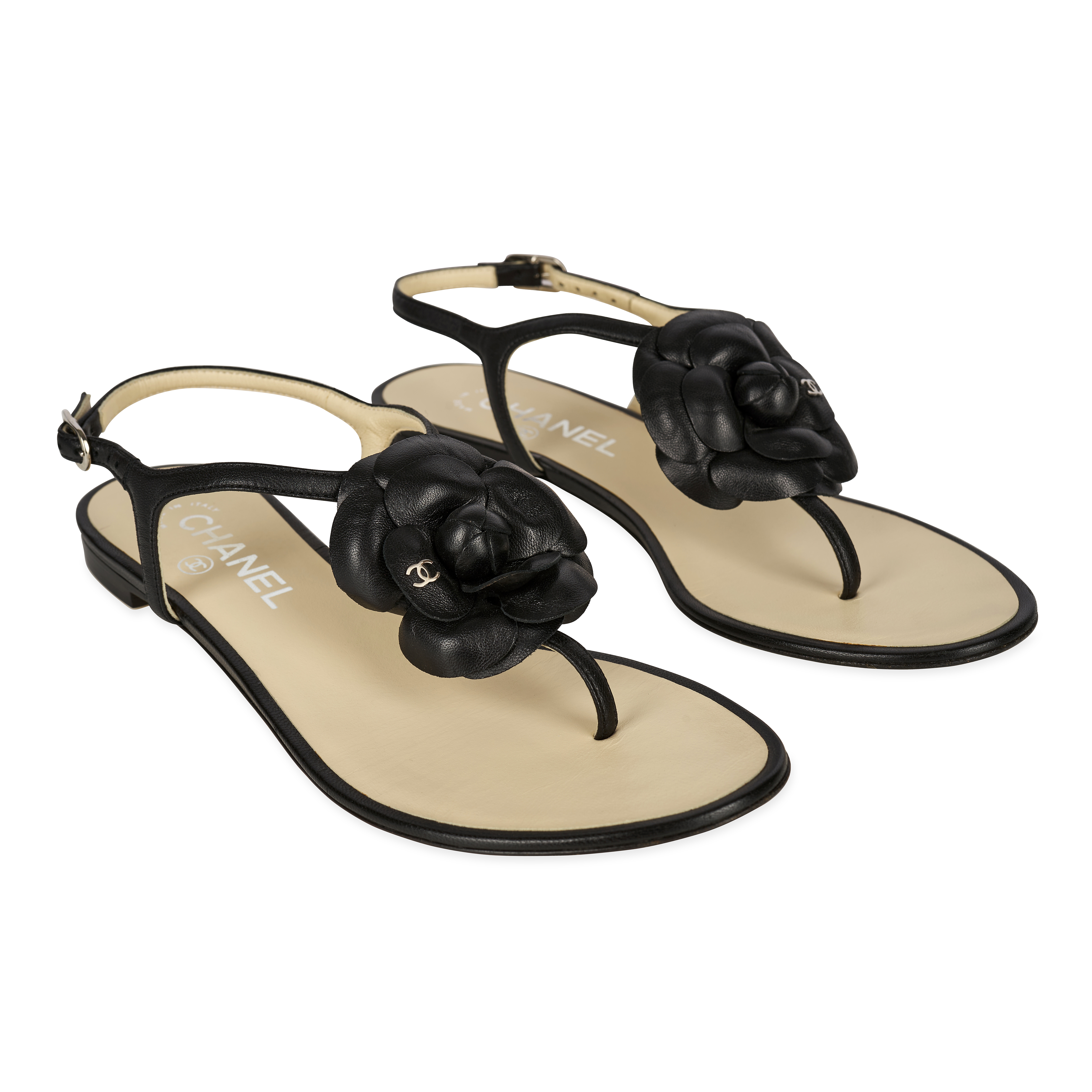 CHANEL CAMELLIA BEIGE AND BLACK SANDALS  Condition grade A-.  Size 37.5C. Black and beige leath...