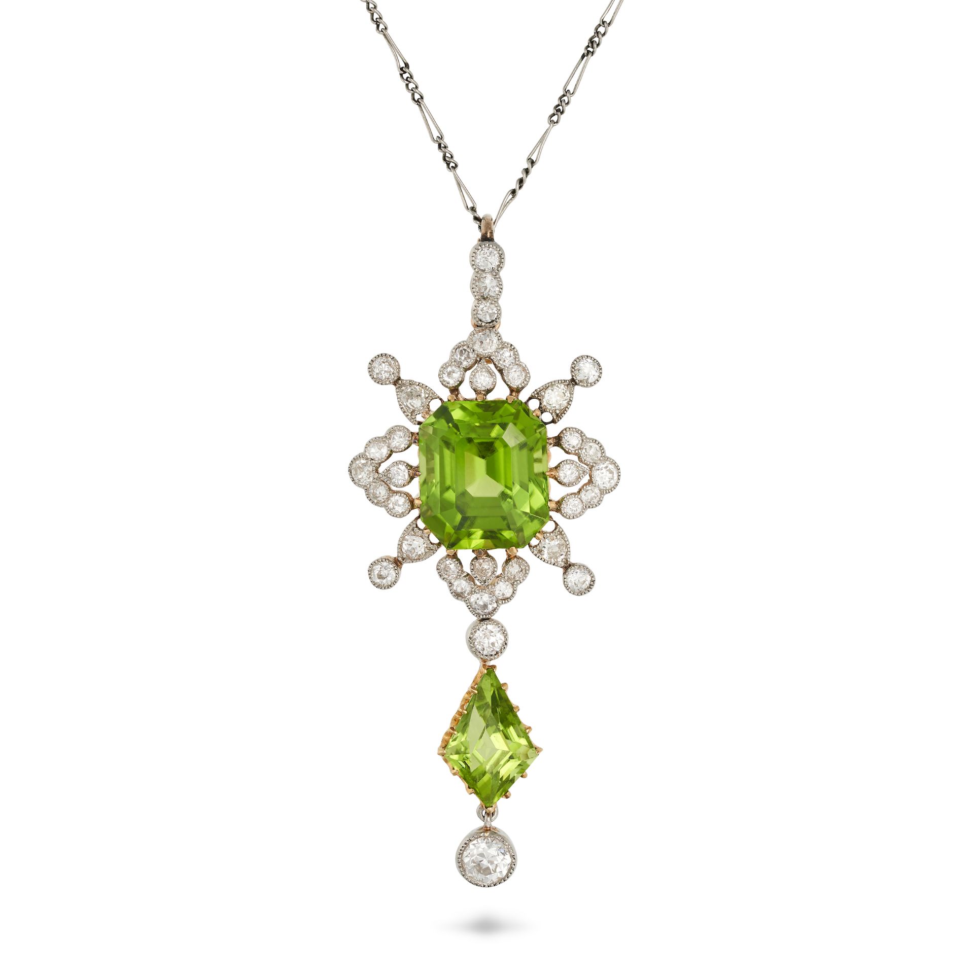 AN ANTIQUE PERIDOT AND DIAMOND PENDANT NECKLACE in yellow gold and platinum, the pendant set with...