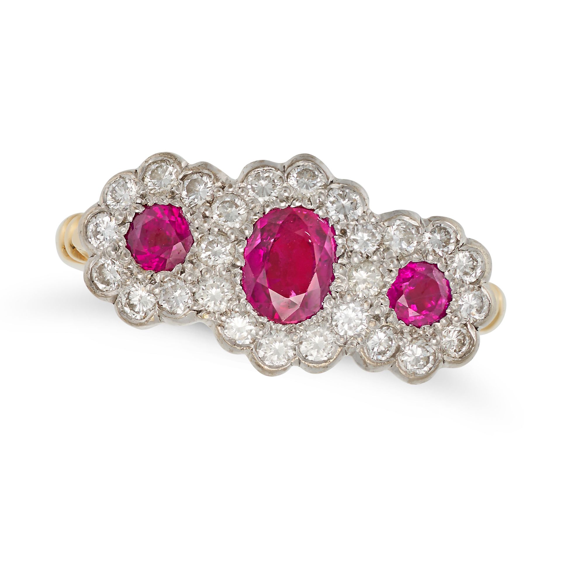 A RUBY AND DIAMOND DRESS RING in 18ct yellow gold, set with three cushion and round cut rubies in...