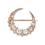 AN ANTIQUE DIAMOND CRESCENT MOON BROOCH in yellow gold and silver, designed as a crescent moon se...