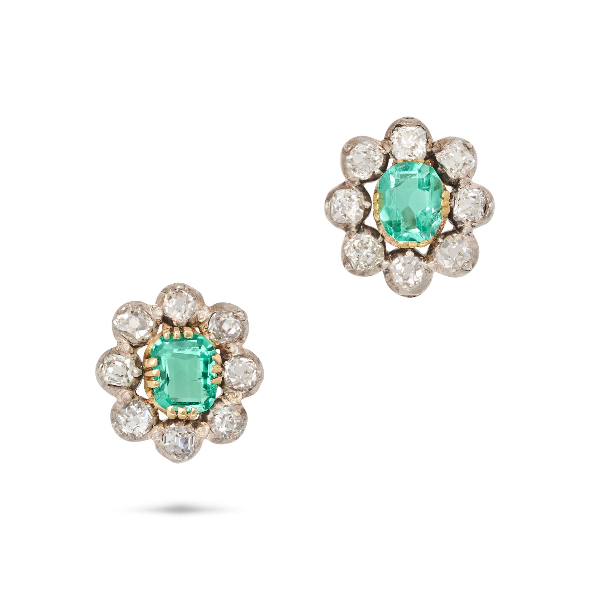 A PAIR OF ANTIQUE EMERALD AND DIAMOND CLUSTER EARRINGS in yellow gold and silver, each set with a...