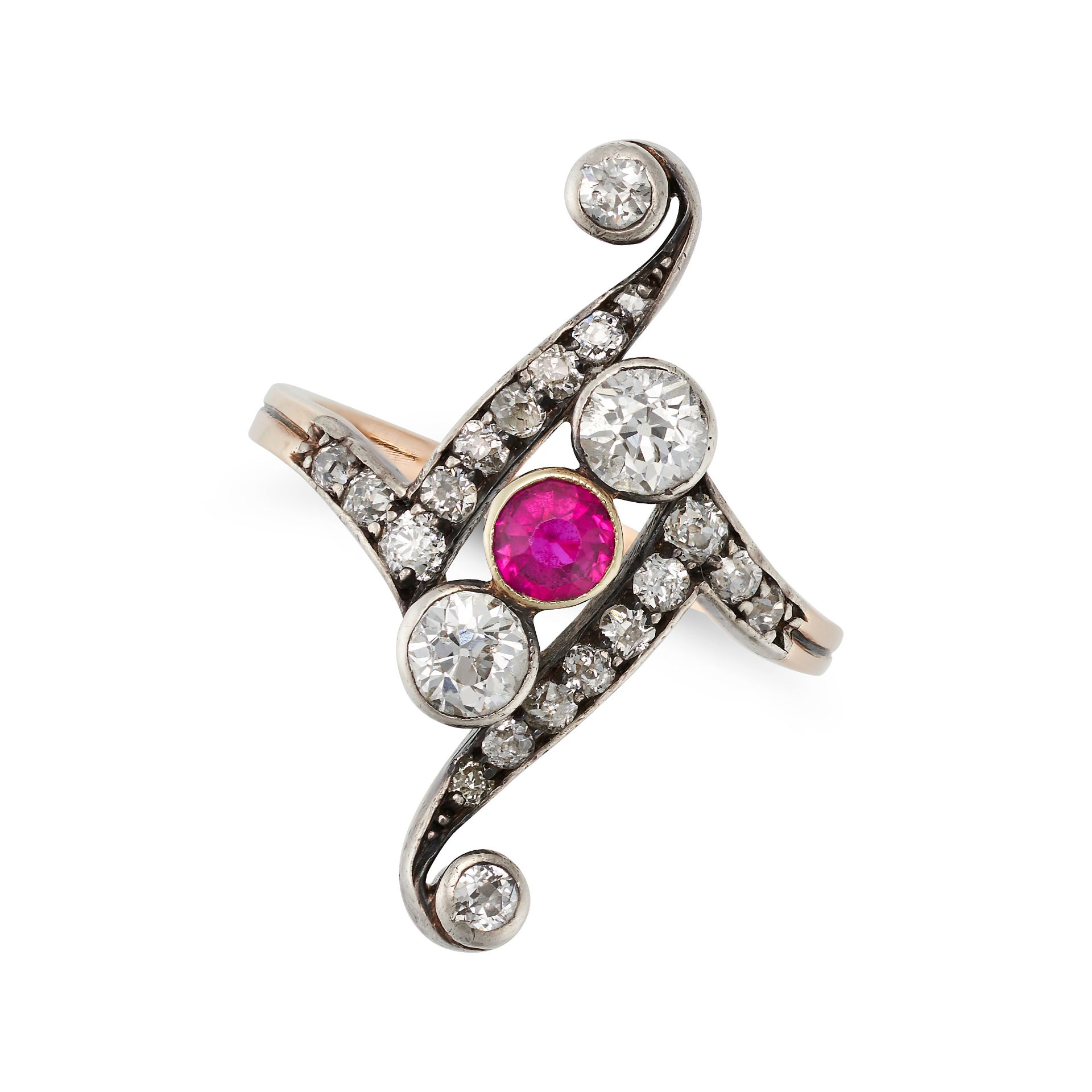AN ANTIQUE RUBY AND DIAMOND DRESS RING in 14ct yellow gold and silver, in scrolling design set wi...