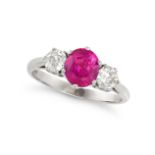 A THREE STONE RUBY AND DIAMOND RING in 18ct white gold, set with an oval cut ruby of approximatel...