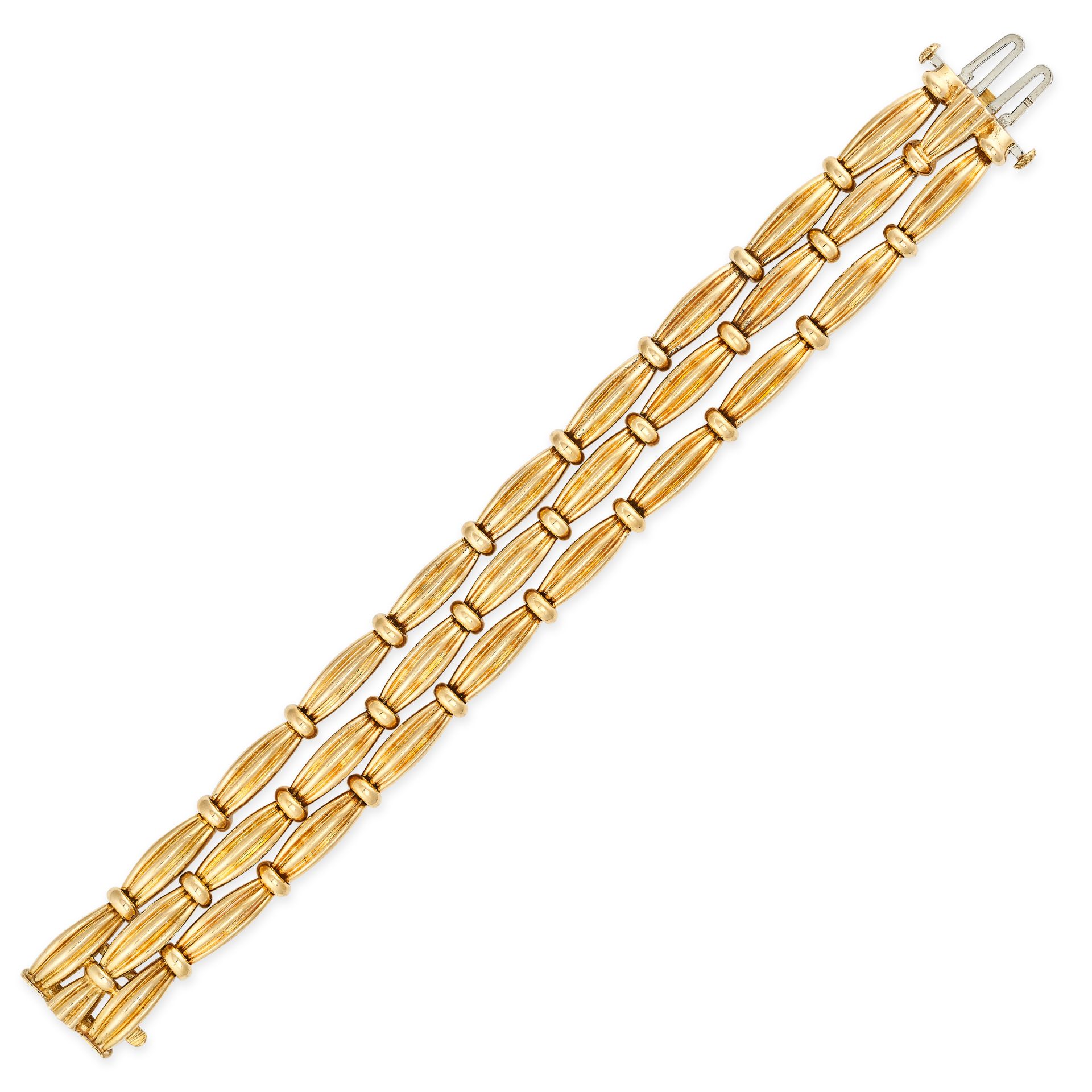 TIFFANY & CO, A GOLD BRACELET in 18ct yellow gold, comprising three rows of fancy reeded links, s...