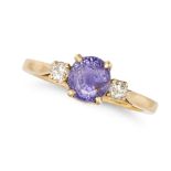 A PURPLE SAPPHIRE AND DIAMOND THREE STONE RING in 18ct yellow gold, set with a round cut purple s...