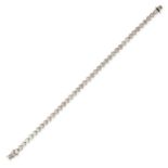 A DIAMOND LINE BRACELET in white gold, set with a row of round brilliant cut diamonds in bezel se...