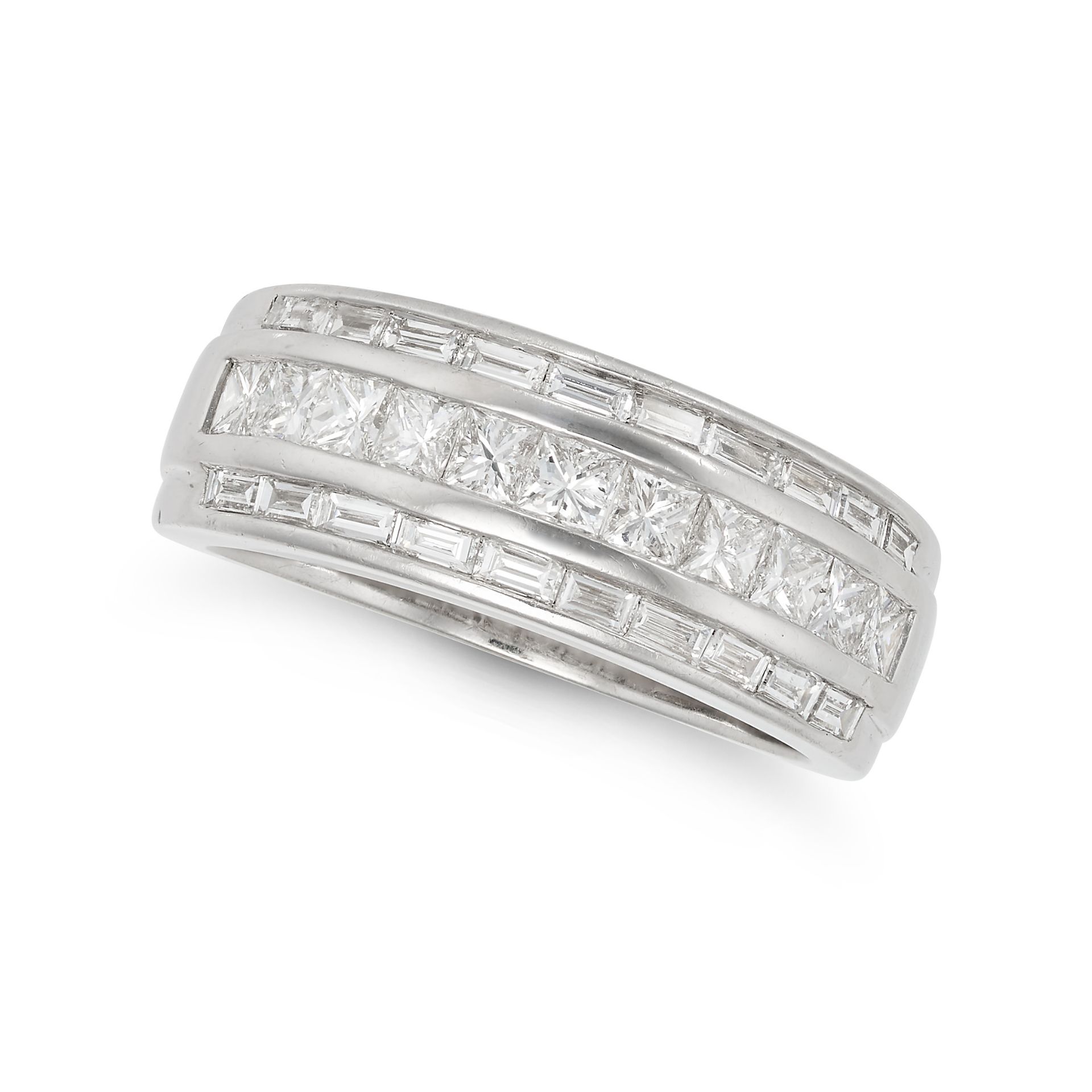 A DIAMOND DRESS RING in 18ct white gold, the tapering band set with a row of princess cut diamond...