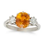 AN ORANGE SAPPHIRE AND DIAMOND THREE STONE RING in 18ct white gold, set with a cushion cut orange...