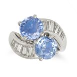 A SAPPHIRE AND DIAMOND TOI ET MOI RING in platinum, set with two round cut sapphires accented by ...
