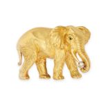 TIFFANY & CO., A VINTAGE DIAMOND ELEPHANT BROOCH in 18ct yellow gold, designed as a standing elep...