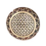 AN ANTIQUE PIQUE TORTOISESHELL BROOCH the domed body inlaid with gold and silver detailing, no as...