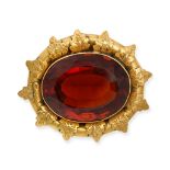 AN ANTIQUE CITRINE BROOCH in yellow gold, set with an oval cut citrine of approximately 32.05 car...