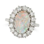 AN OPAL AND DIAMOND CLUSTER RING in 18ct white gold, set with an oval cabochon opal in a cluster ...