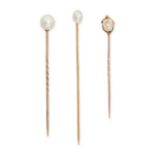 A COLLECTION OF THREE PEARL STICK PINS in 18ct yellow gold, each set with a pearl, no assay marks...