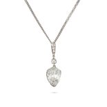 A DIAMOND PENDANT AND CHAIN in white gold and platinum, the pendant set with round brilliant cut ...