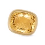 A CITRINE COCKTAIL RING in yellow gold, set with a large cushion cut citrine in a chunky gold set...