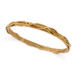 CHARLES DE TEMPLE, A VINTAGE GOLD BANGLE in 18ct yellow gold, the bangle with an applied stylised...