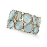 POMELLATO, A BLUE TOPAZ AND DIAMOND RING in 18ct yellow gold, set with two rows of rose cut blue ...