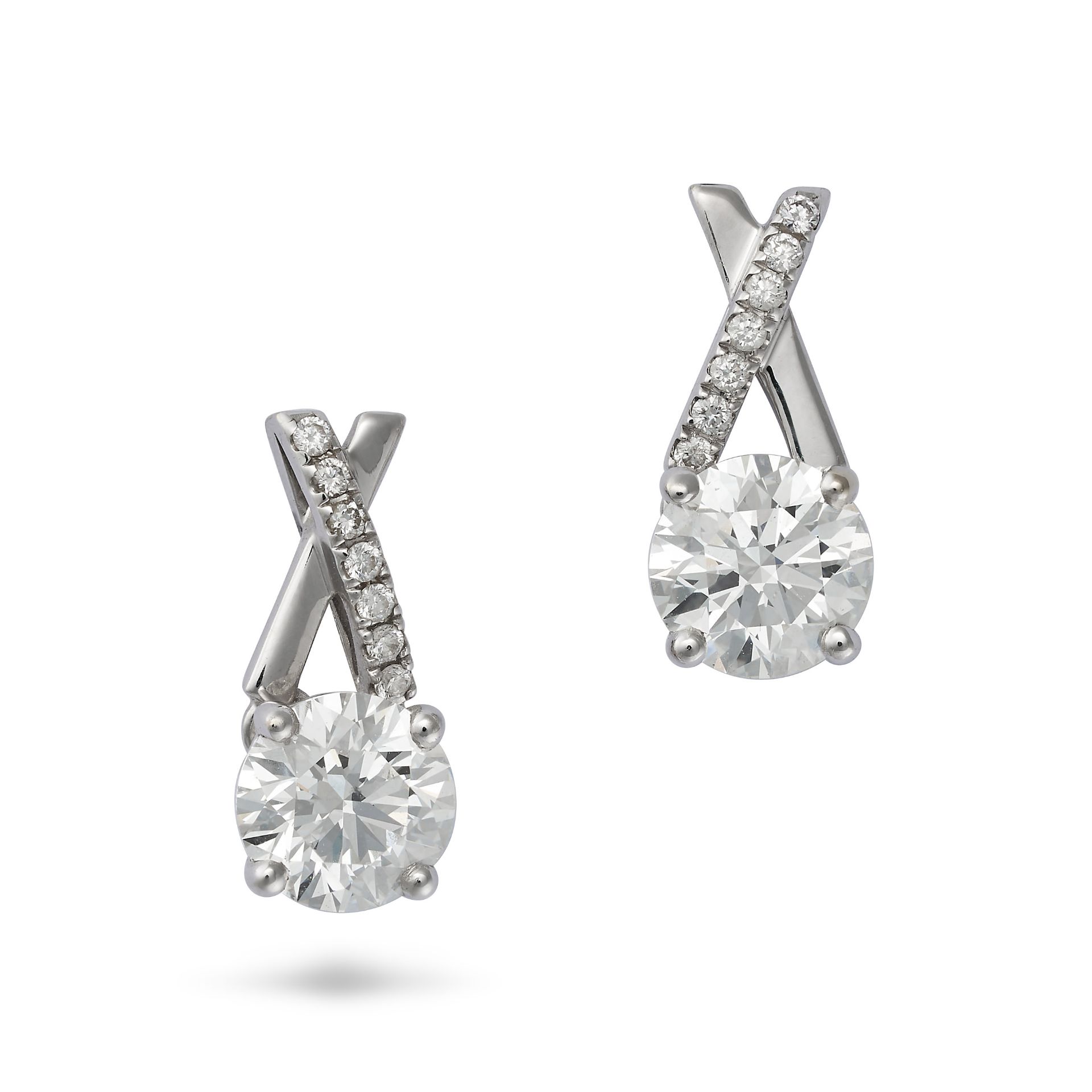 DE BEERS, A PAIR OF DIAMOND EARRINGS in 18ct white gold, each comprising an X motif set with roun...
