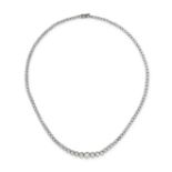 A FINE DIAMOND RIVIERE NECKLACE in platinum, set with a row of round brilliant cut diamonds all t...