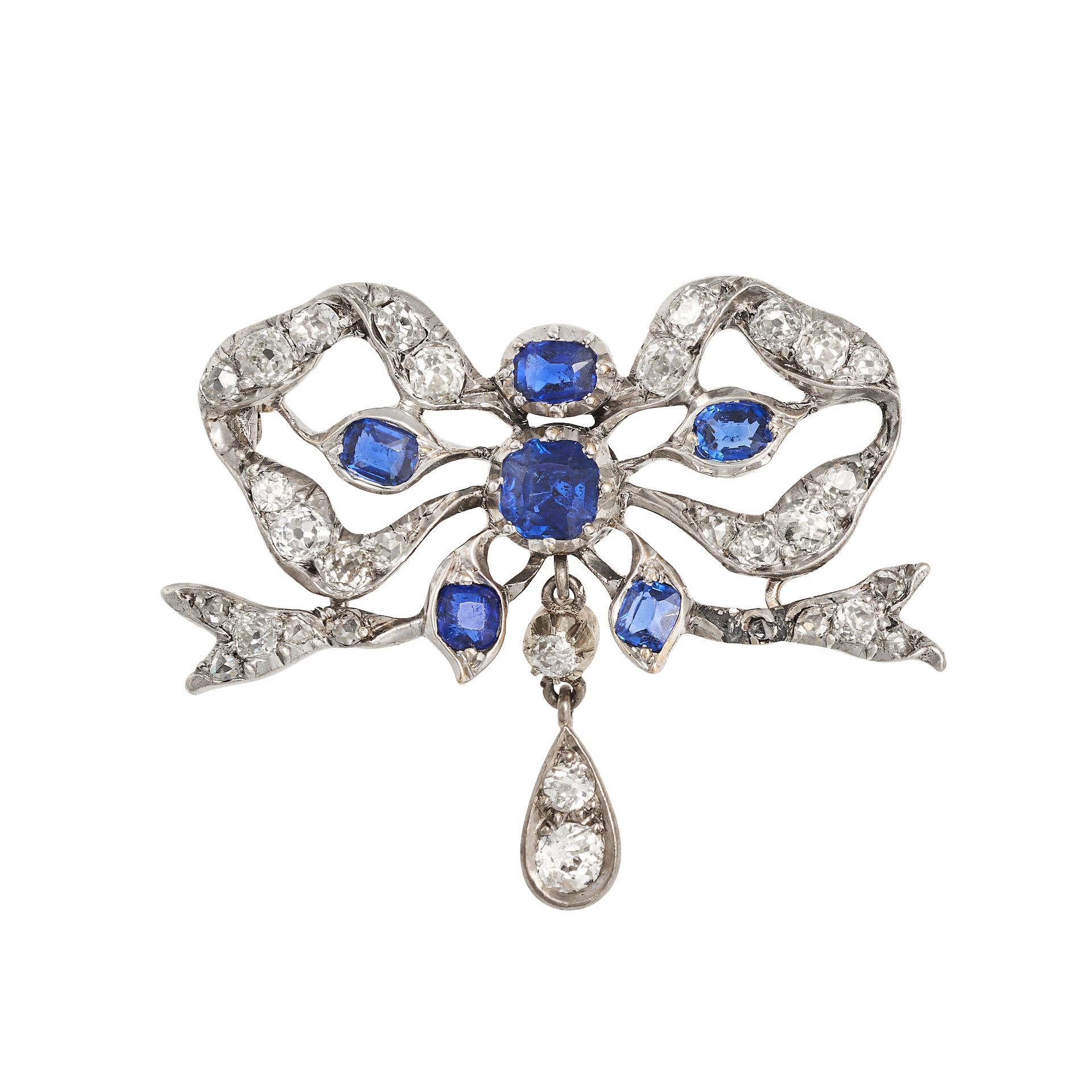 AN ANTIQUE  SAPPHIRE AND DIAMOND BOW BROOCH in yellow gold and silver, designed as a bow set with...