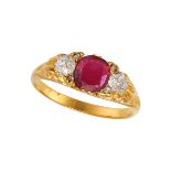 A RUBY AND DIAMOND THREE STONE RING in 18ct yellow gold, set with a cushion cut ruby of approxima...