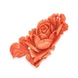 A CARVED CORAL ROSE PLAQUE carved to depict a rose and leaves, 4.5cm, 5.5g.