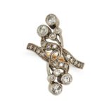 A DIAMOND DRESS RING in yellow gold, in crossover design, set throughout with round brilliant and...