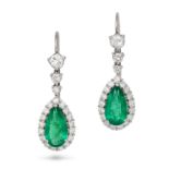 A PAIR OF EMERALD AND DIAMOND DROP EARRINGS in platinum and 18ct white gold, each set with a row ...