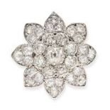 A FINE ANTIQUE DIAMOND FLOWER BROOCH in gold and silver, designed as the head of a flower, set th...