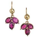 A PAIR OF ANTIQUE GARNET DROP EARRINGS in yellow gold, each set with three oval cut garnets, no a...