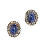 A PAIR OF SAPPHIRE AND DIAMOND CLUSTER EARRINGS in yellow gold, each set with an oval cabochon sa...