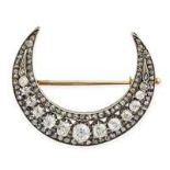 AN ANTIQUE DIAMOND CRESCENT MOON BROOCH, 19TH CENTURY in yellow gold and silver, designed as a cr...