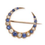 AN ANTIQUE SAPPHIRE AND DIAMOND CRESCENT MOON BROOCH / PENDANT in yellow gold, designed as a cres...