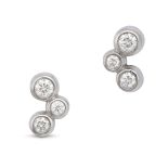 TIFFANY & CO., A PAIR OF DIAMOND BUBBLE EARRINGS, 2009 in platinum, each set with three round bri...