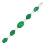 A JADEITE JADE BRACELET in white gold, set with a row of five oval jadeite jade plaques carved to...