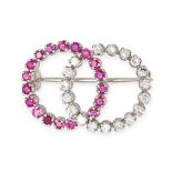 A RUBY AND DIAMOND BROOCH in 18ct white gold, designed as two intersecting circles each set with ...