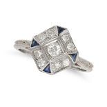 A DIAMOND AND SAPPHIRE DRESS RING in white gold, set with an old European cut diamond in a border...