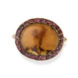 AN ANTIQUE DENDRITIC AGATE AND GARNET RING in yellow gold, set with an oval dendritic agate withi...