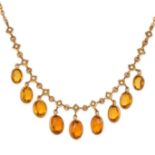 AN ANTIQUE CITRINE AND PEARL NECKLACE in yellow gold, comprising a trace chain set with a row of ...