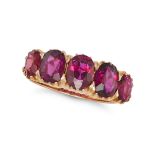 A RUBY FIVE STONE RING in yellow gold, set with a row of five graduated oval cut rubies, the rubi...