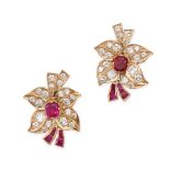 A PAIR OF RUBY AND DIAMOND FLOWER EARRINGS in yellow gold, each designed as a flower set with cus...
