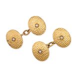 A PAIR OF ANTIQUE VICTORIAN PEARL CUFFLINKS in 18ct yellow gold, the textured oval faces set with...
