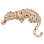 A DIAMOND, BLACK DIAMOND AND EMERALD PANTHER BROOCH in 18ct yellow gold, set throughout with roun...