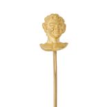 WIESE, A GOLD STICK PIN in yellow gold, designed as the head of an elf, signed WIESE, no assay ma...
