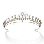 A MOONSTONE AND DIAMOND TIARA set throughout with round cabochon moonstones and accented by rose ...