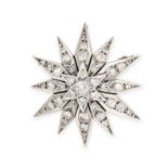 A DIAMOND STAR BROOCH / PENDANT in yellow gold and silver, designed as a twelve rayed star and se...